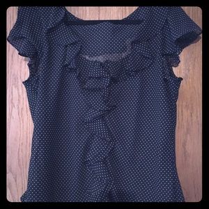 Black & white polka dot sleeveless top.