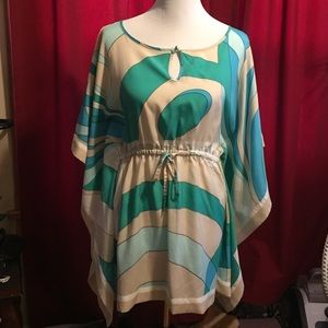 Coverup can be worn over a swimsuit or over pants