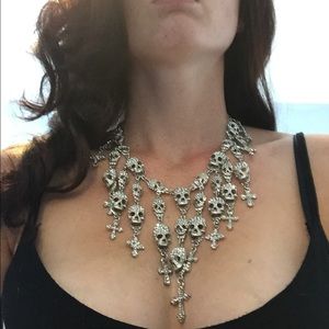 Skull and cross necklace.