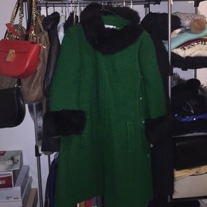 Green wool coat with faux fur on wrist and neck.