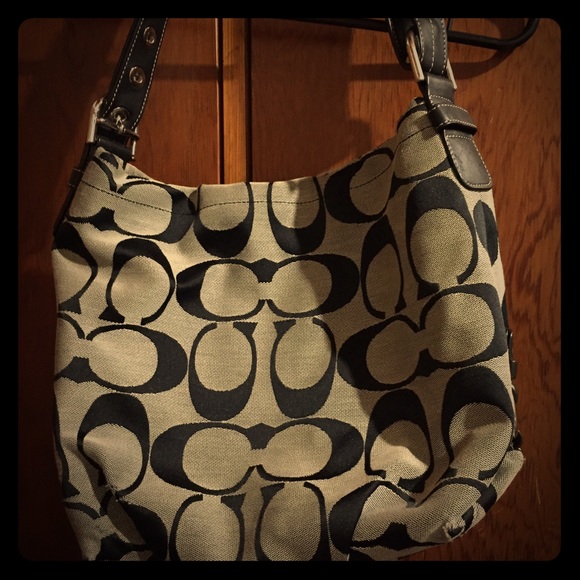 Black and gray Coach hand bag.