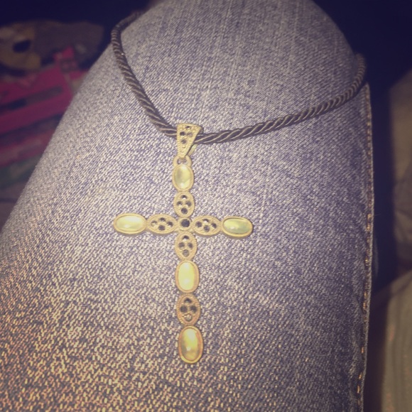 Cross necklace with light blue gems