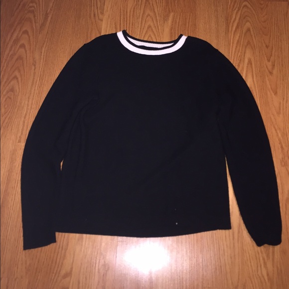 Black sweater with white collar