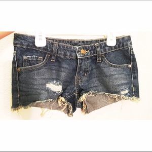 Distressed denim mini shorts.