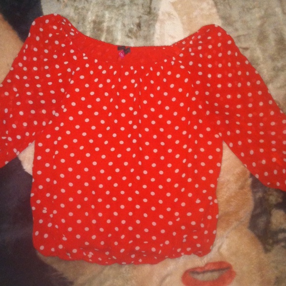 Red and white polka dot blouse.