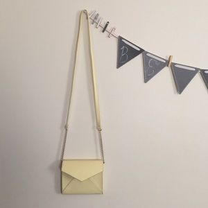Pale yellow cross body