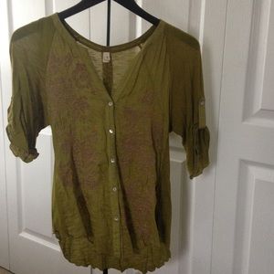 Embroidered bodice on soft green blouse.