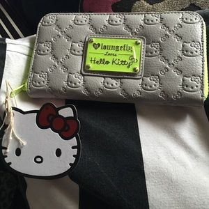 Brand new Hello Kitty Wallet. Grey w/ neon detail