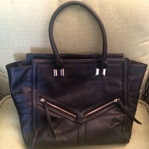Edgy black leather tote bag