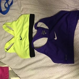 Two Nike sports bras.. Neon green/yellow and pink
