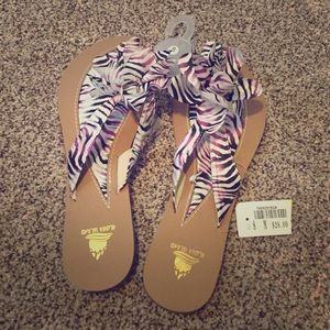 Zebra print flowered flip flops