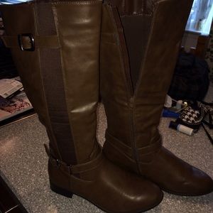Brown riding boots.
