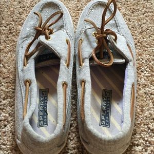 Silver sequined sperry shoes.