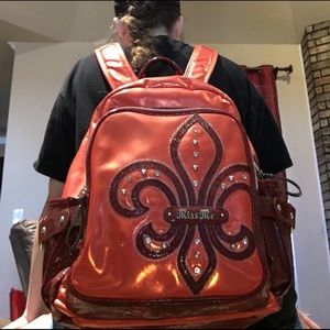Orange and burgundy Miss Me backpack
