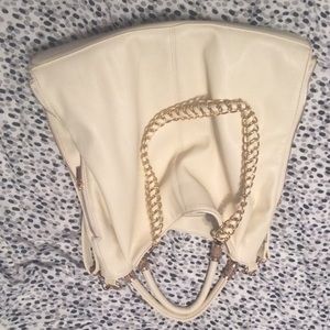 Cream purse with snake pattern