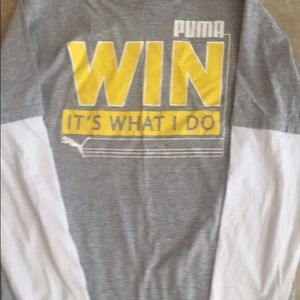 Two Puma shirts and a pair of Puma shorts