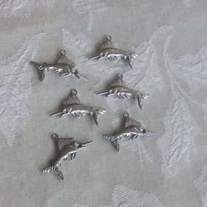 Set of Marlin charms.