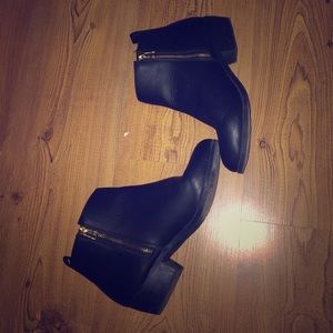 Black booties with zippers