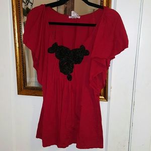 Red rosette front shirt