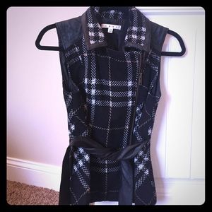 Black and white vest with faux leather details