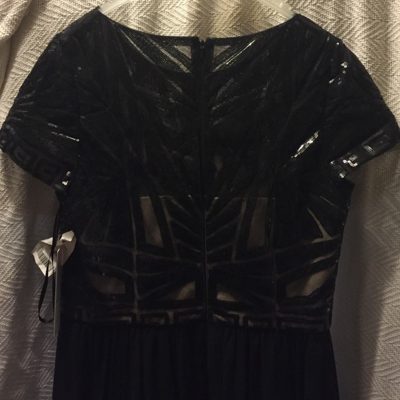 Formaldress worn once has tags and tailored slip