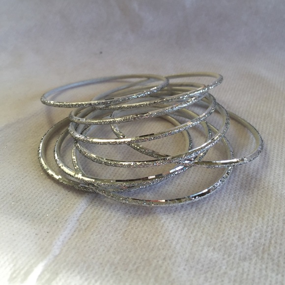 NWOT SILVER BANGLES.