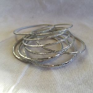 NWOT SILVER BANGLES.