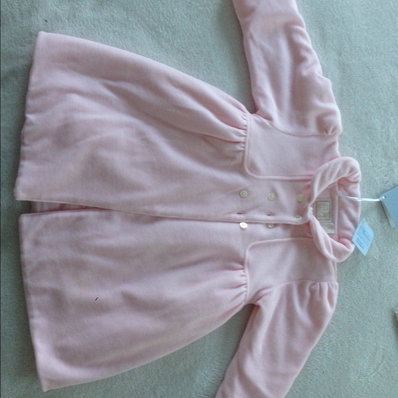 Gorgeous designer coat for a baby.