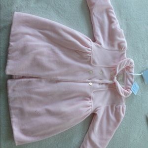 Gorgeous designer coat for a baby.