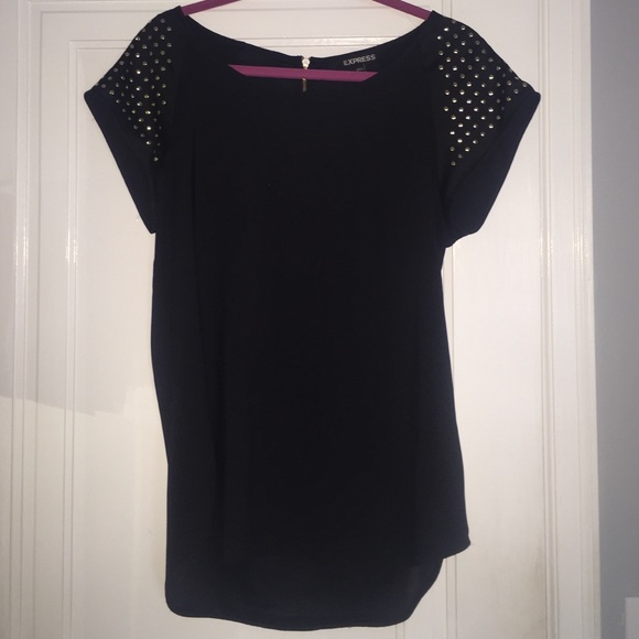 Black shirt with gold studded sleeves.