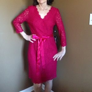 Red 3/4 sleeve knee length lace overlay dress.