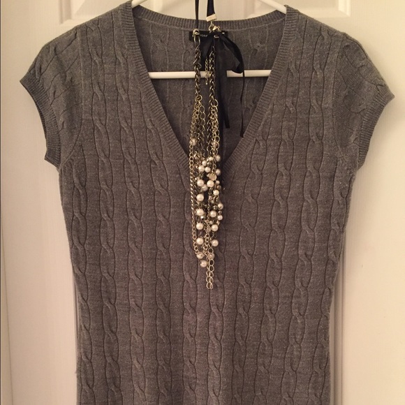 Sweater with cap sleeves, fits small or medium.