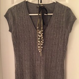 Sweater with cap sleeves, fits small or medium.