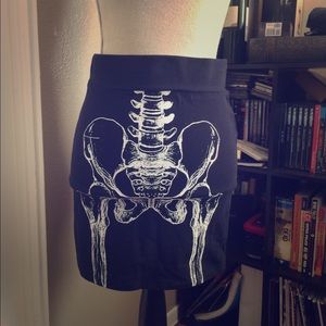 Iron fist skeleton mini skirt