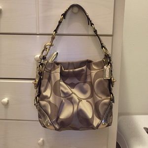 Tan/gold signature print coach purse & dust bag.