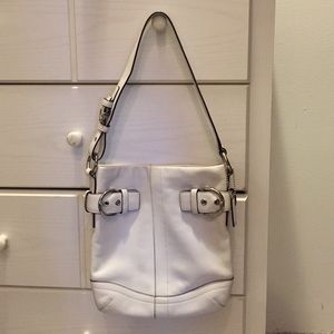 White leather coach purse with dust bag.