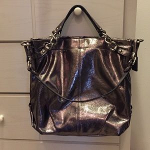 Silver coach purse with dust bag.