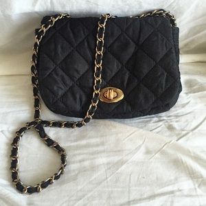 Black padded over the shoulder bag/clutch.