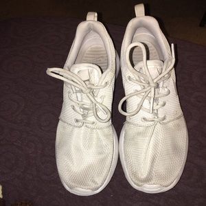 Worn white roshes runs