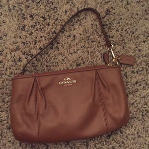 Authentic coach clutch