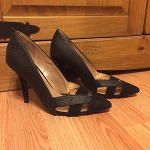 Black pointed toe pumps