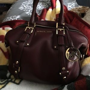 Michael kors blood red bag.... Perfect sharp.