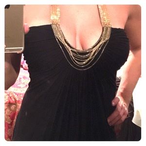 Black top with gold around neck line