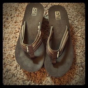 Brown Teva flip fops