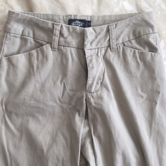 Neutral tone flared bottom pants.