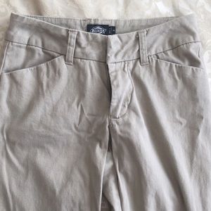 Neutral tone flared bottom pants.