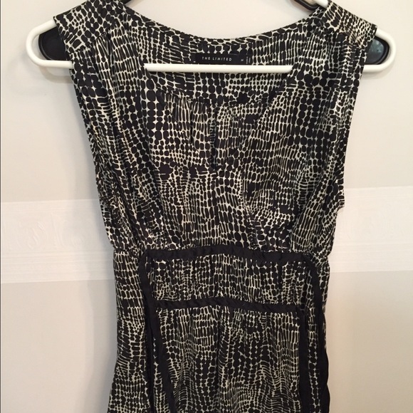 The limited. Silk black and white blouse