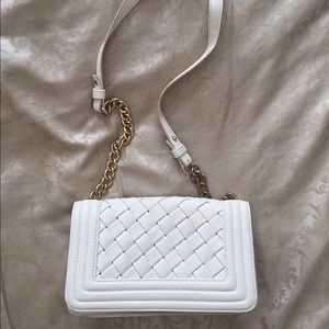 White padded over the shoulder bag.