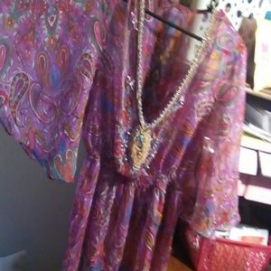 a sequin sheer top with beads