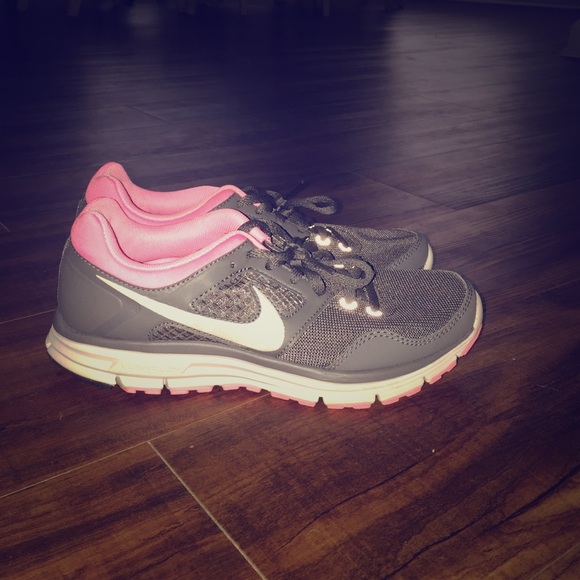 Gray and pink Nike tennis shoes
